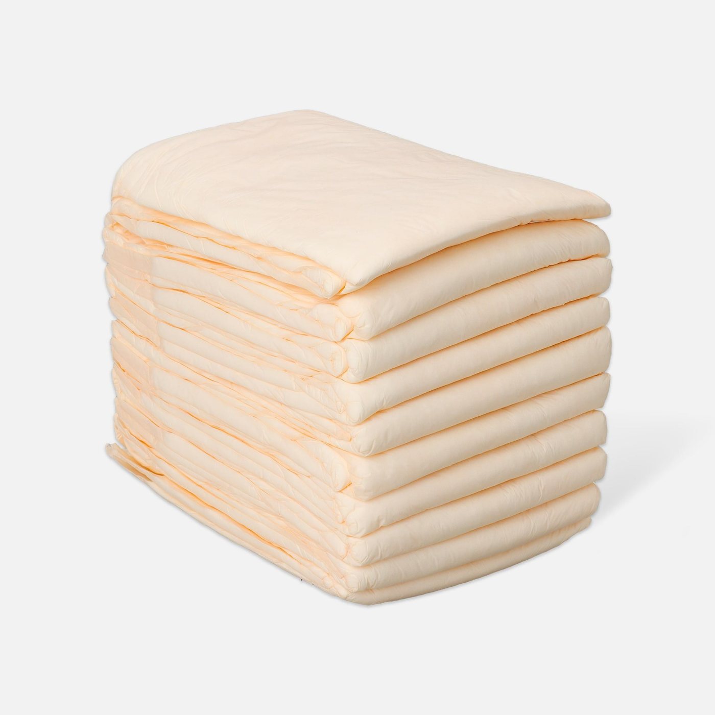 Stack of folded peach underpads